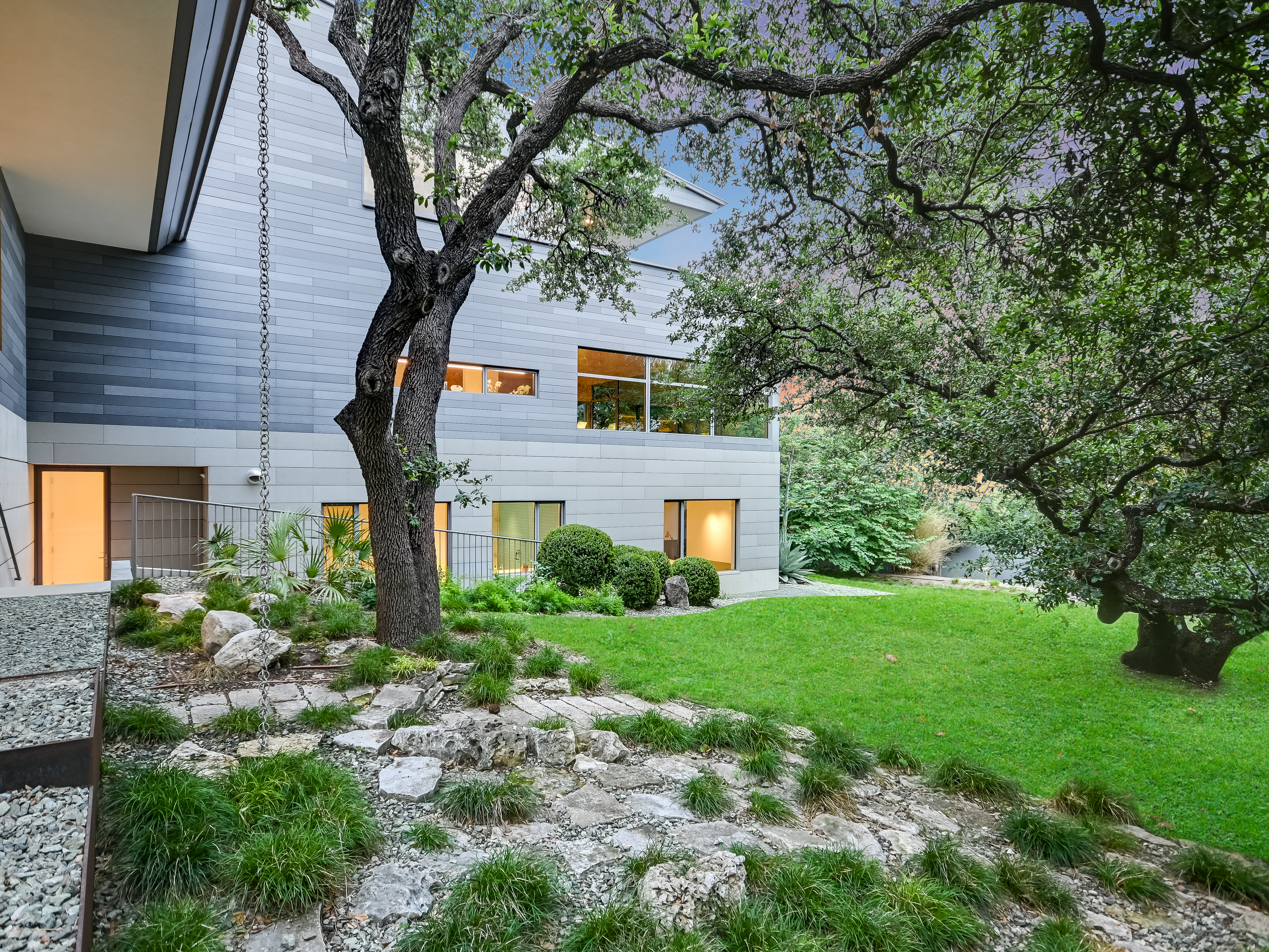 Side yard elevation with natural stone terracing