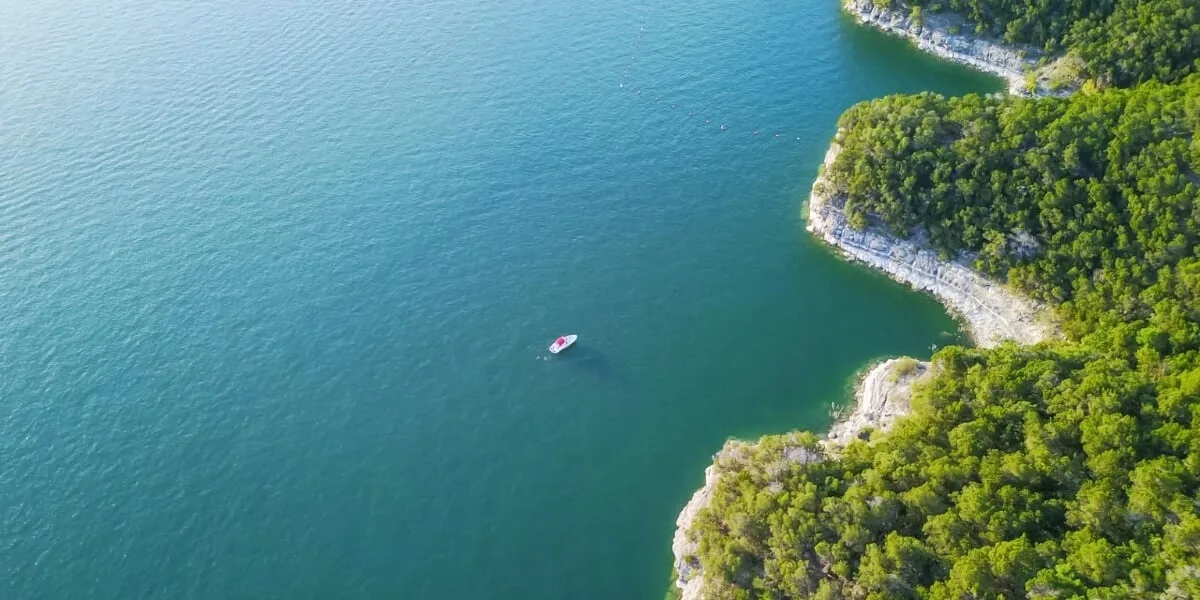 Lake Austin waterfront estate setting with dock access and Hill Country shoreline