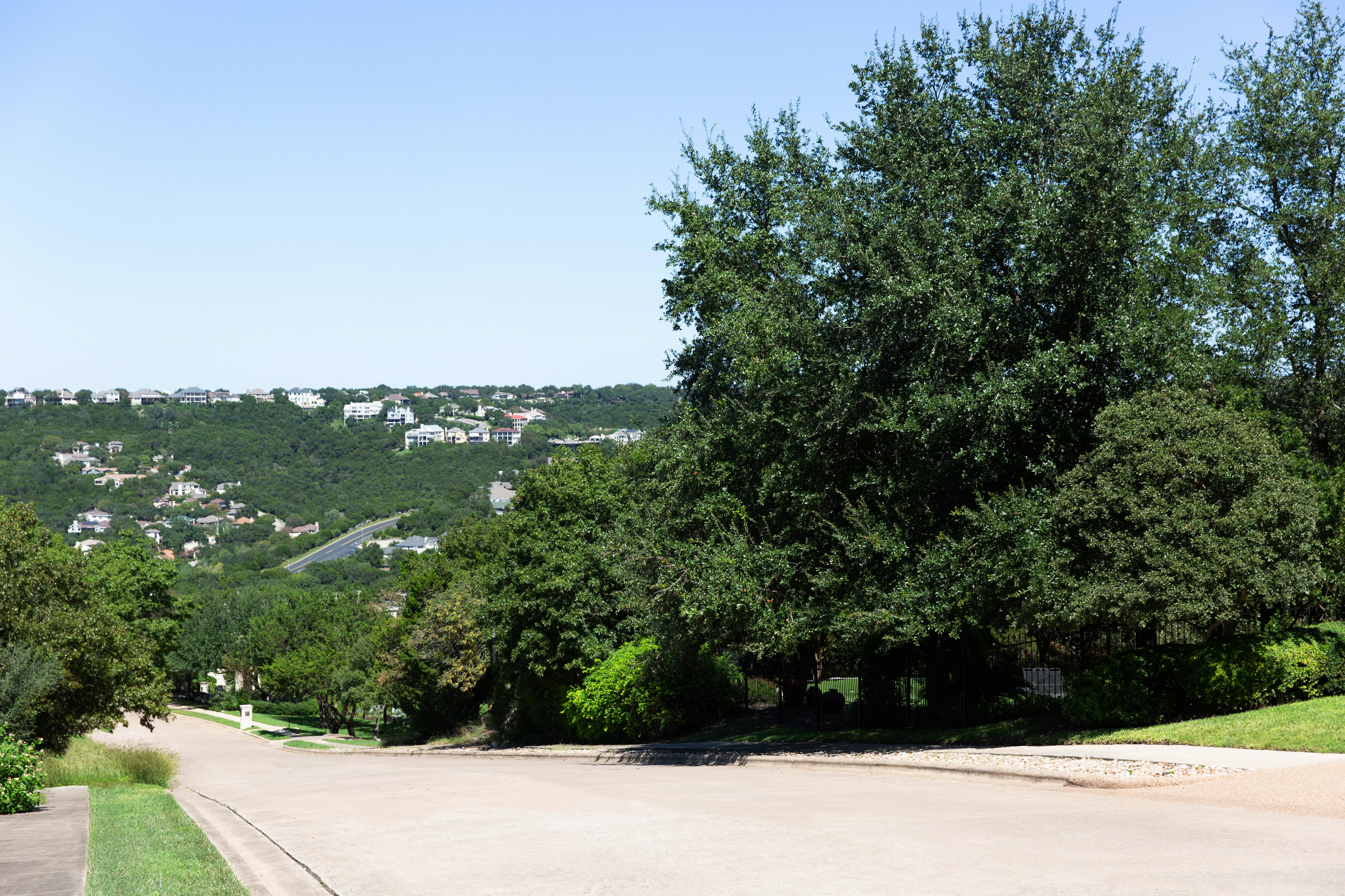 Northwest Hills homes with downtown skyline visible in background