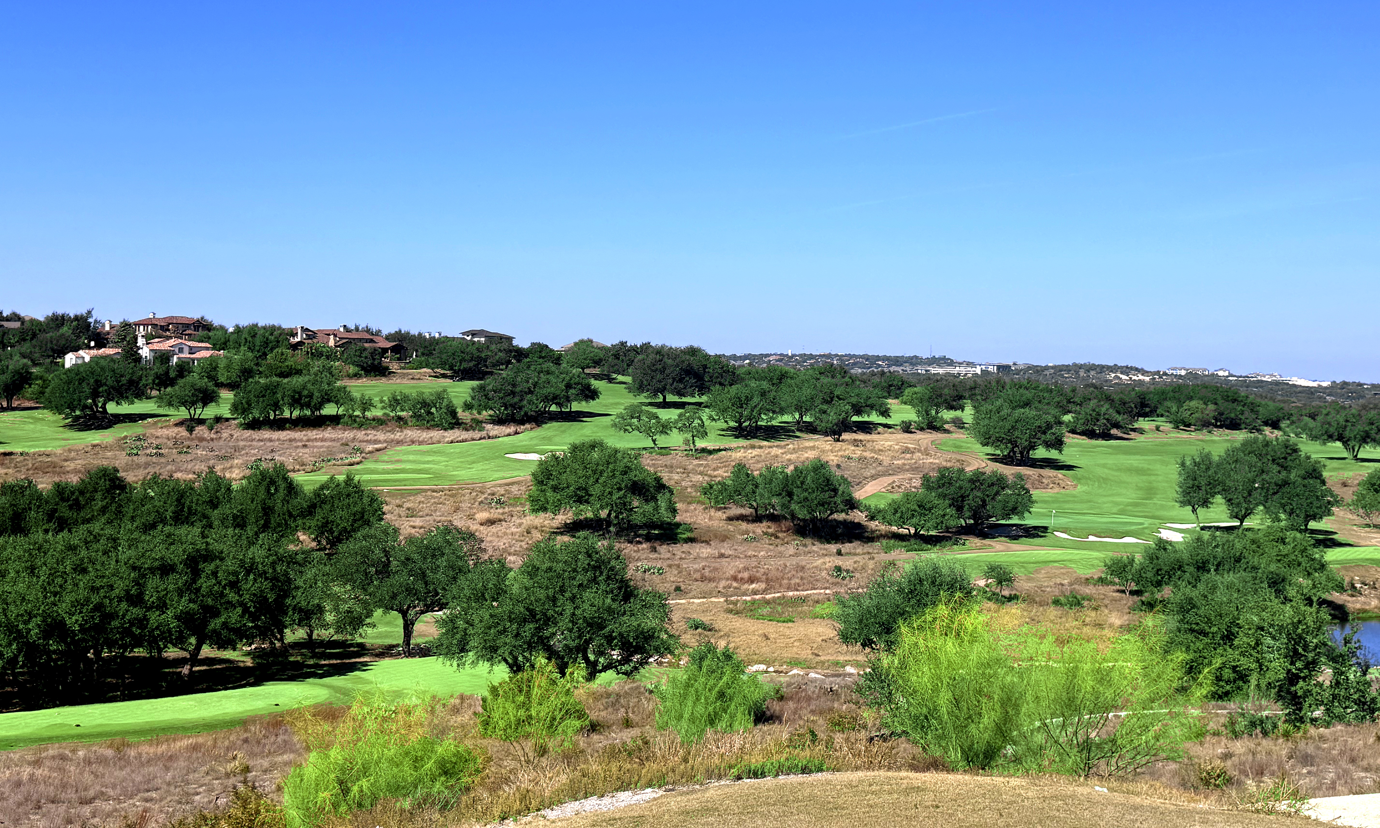 Spanish Oaks Golf Course fairway with Hill Country backdrop