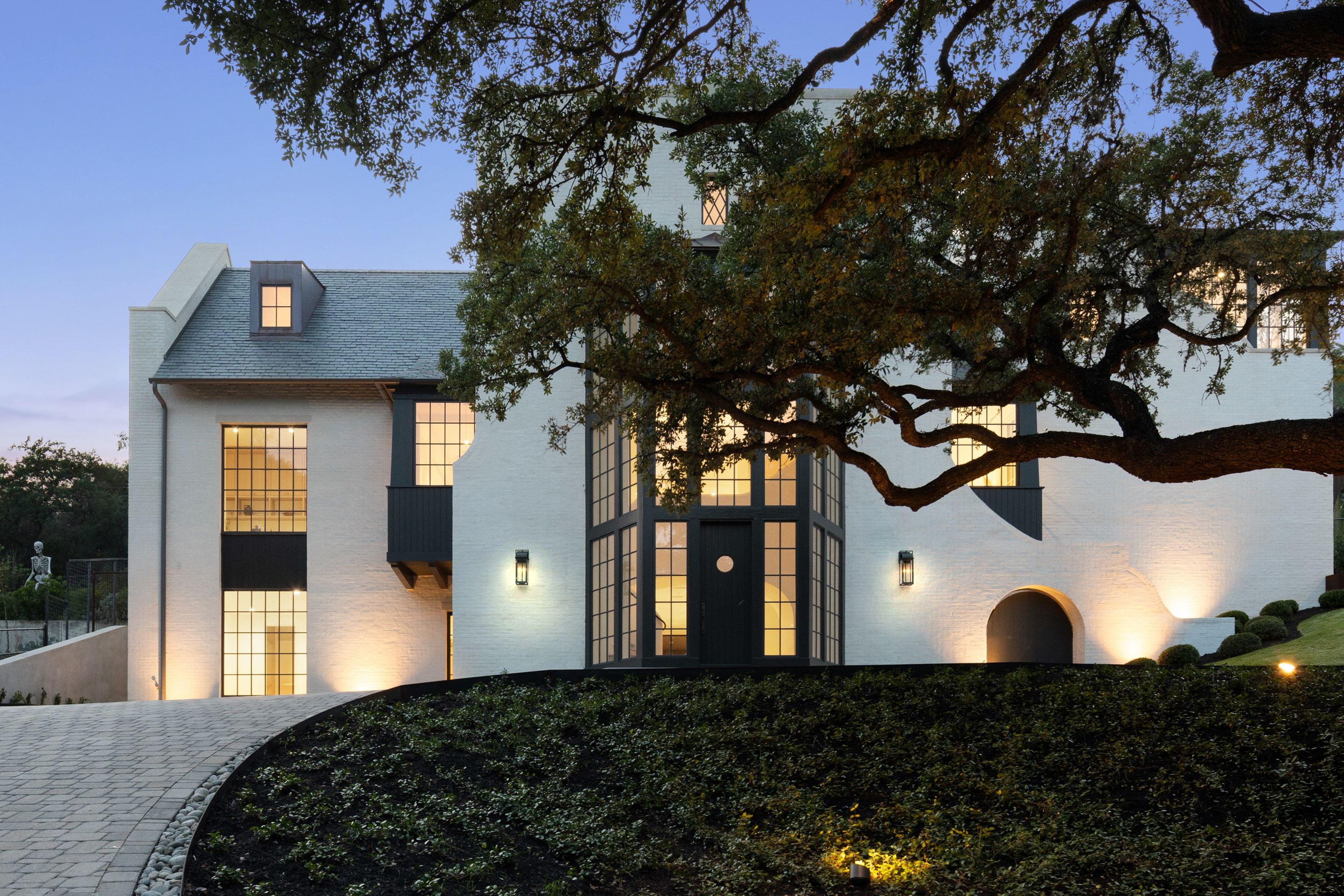 3802 Balcones Drive front oak canopy twilight