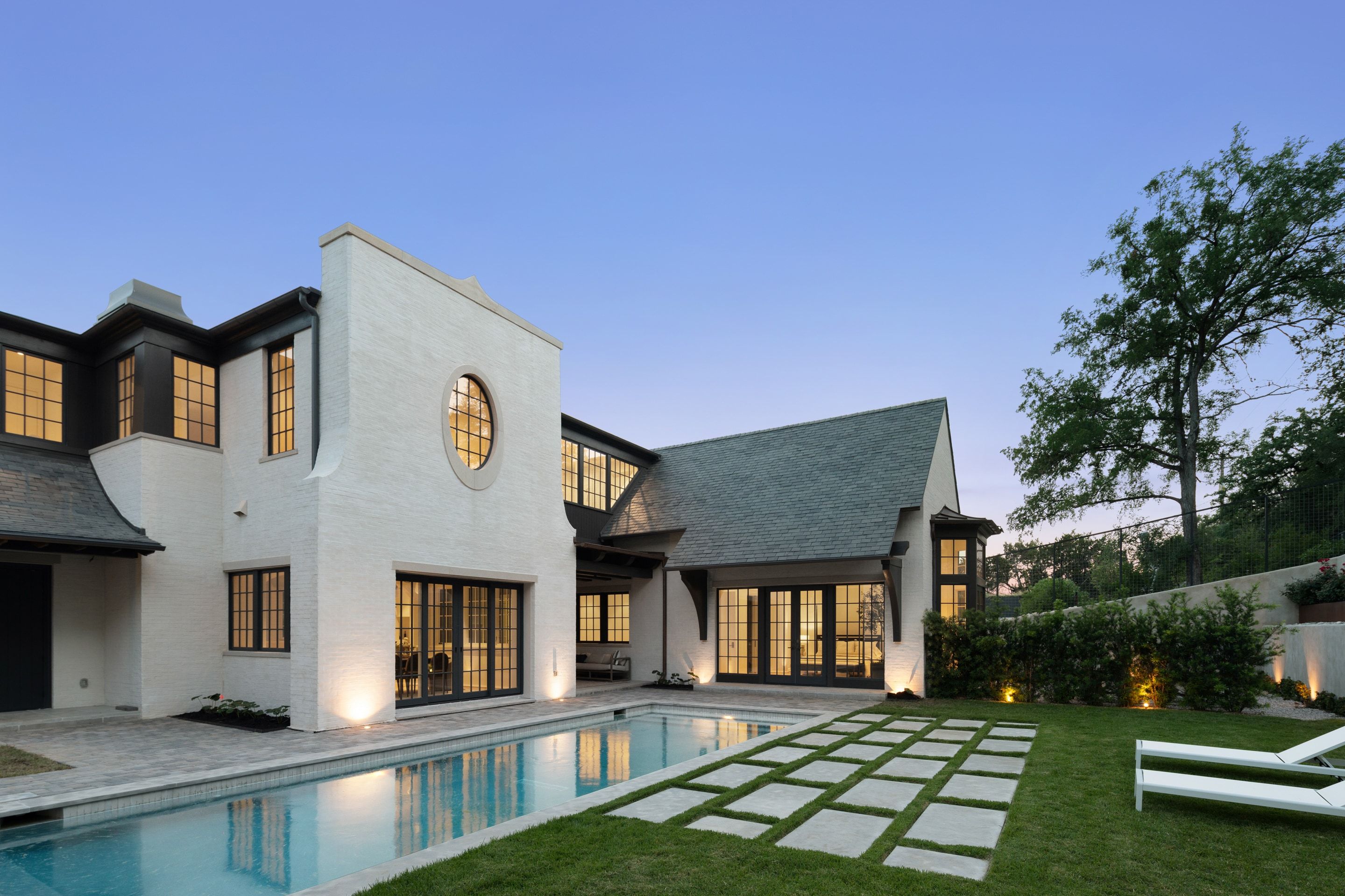 3802 Balcones Drive rear elevation pool twilight