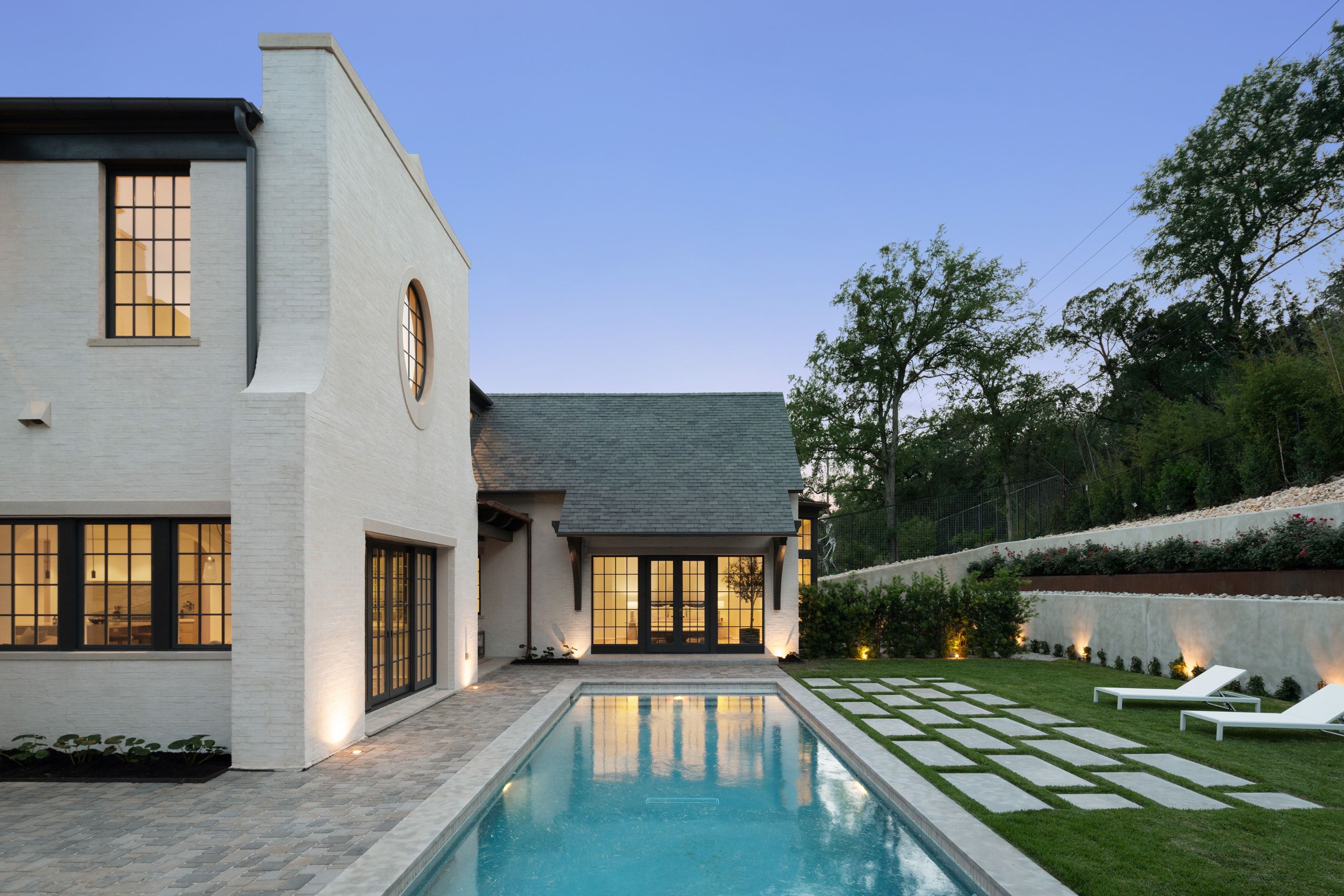 3802 Balcones Drive rear pool elevation dusk