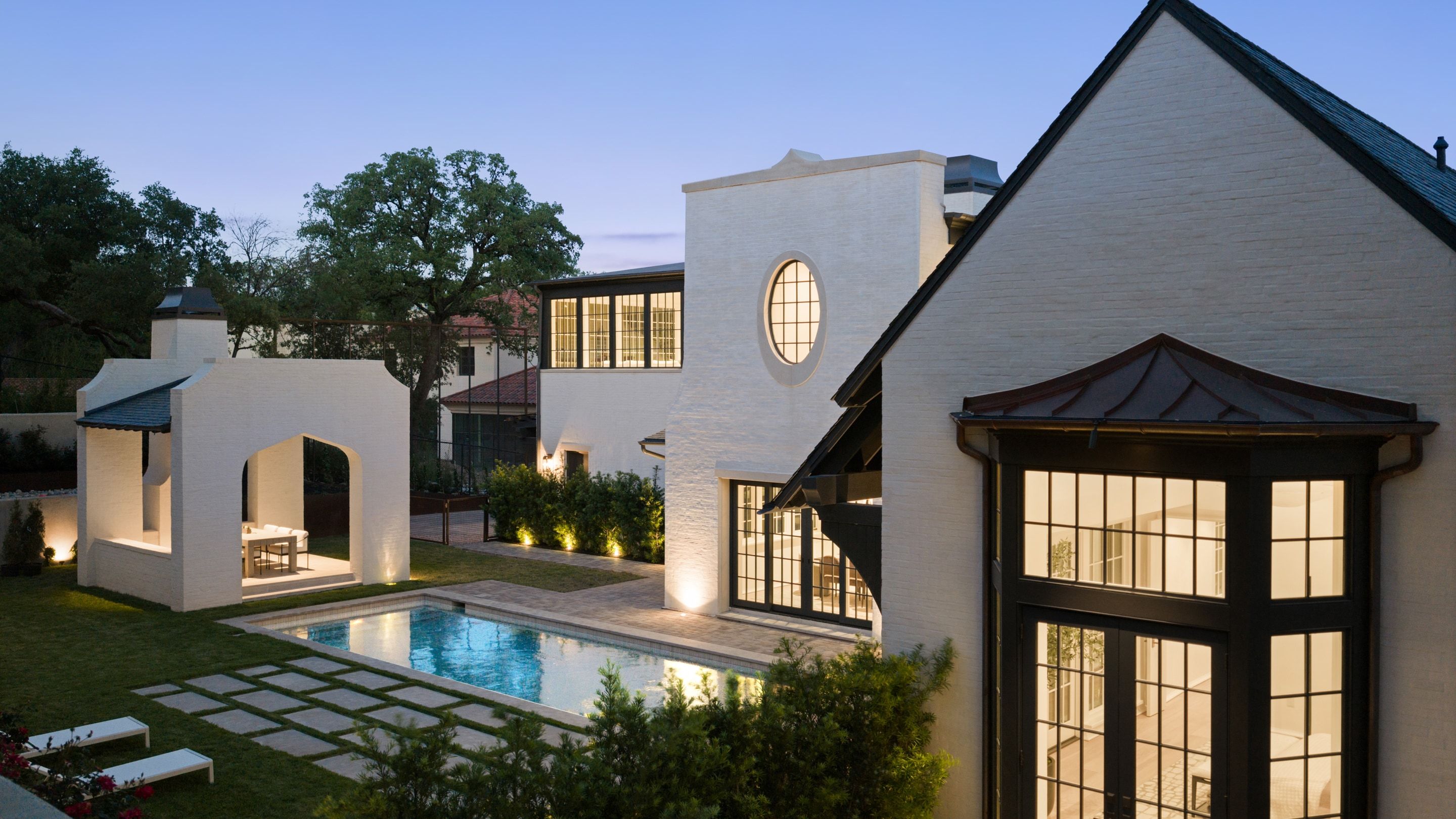 3802 Balcones Drive rear pool bay window dusk