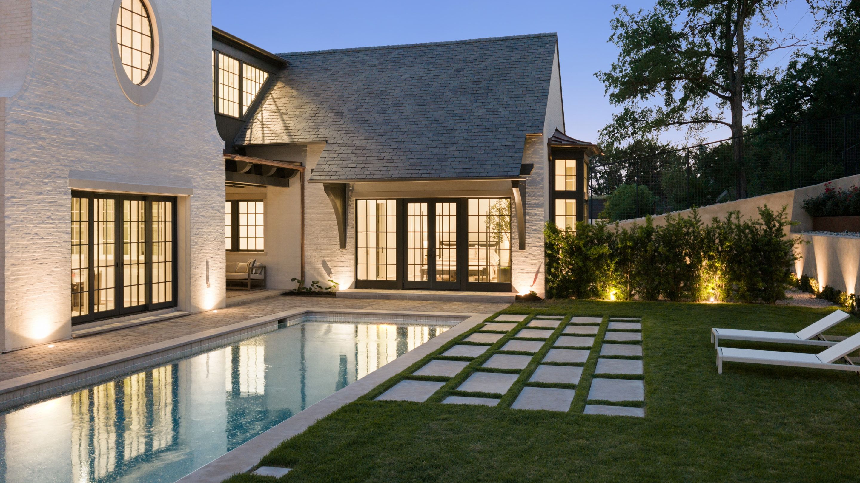 3802 Balcones Drive rear pool lawn angle dusk