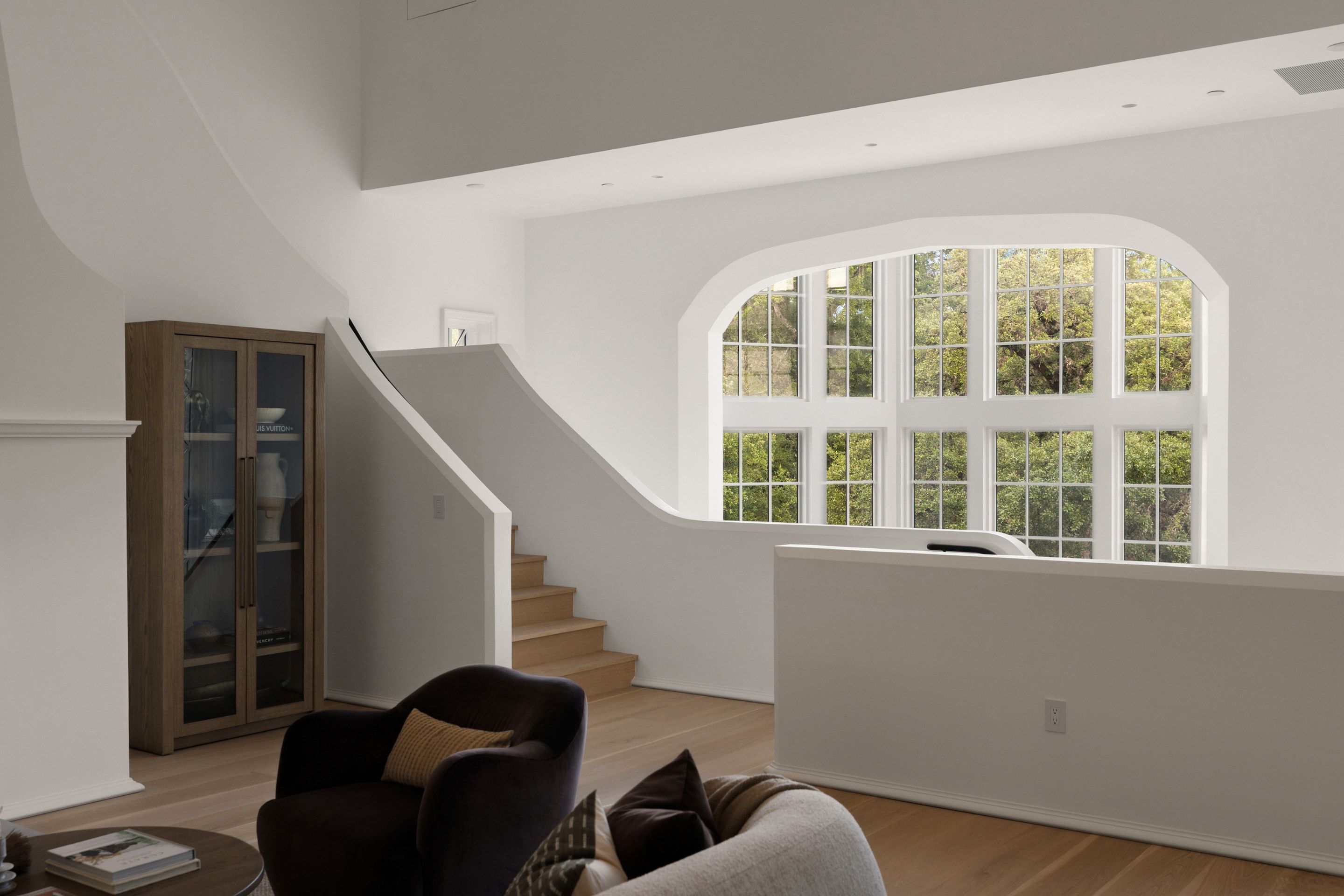 3802 Balcones Drive living room and curved stair