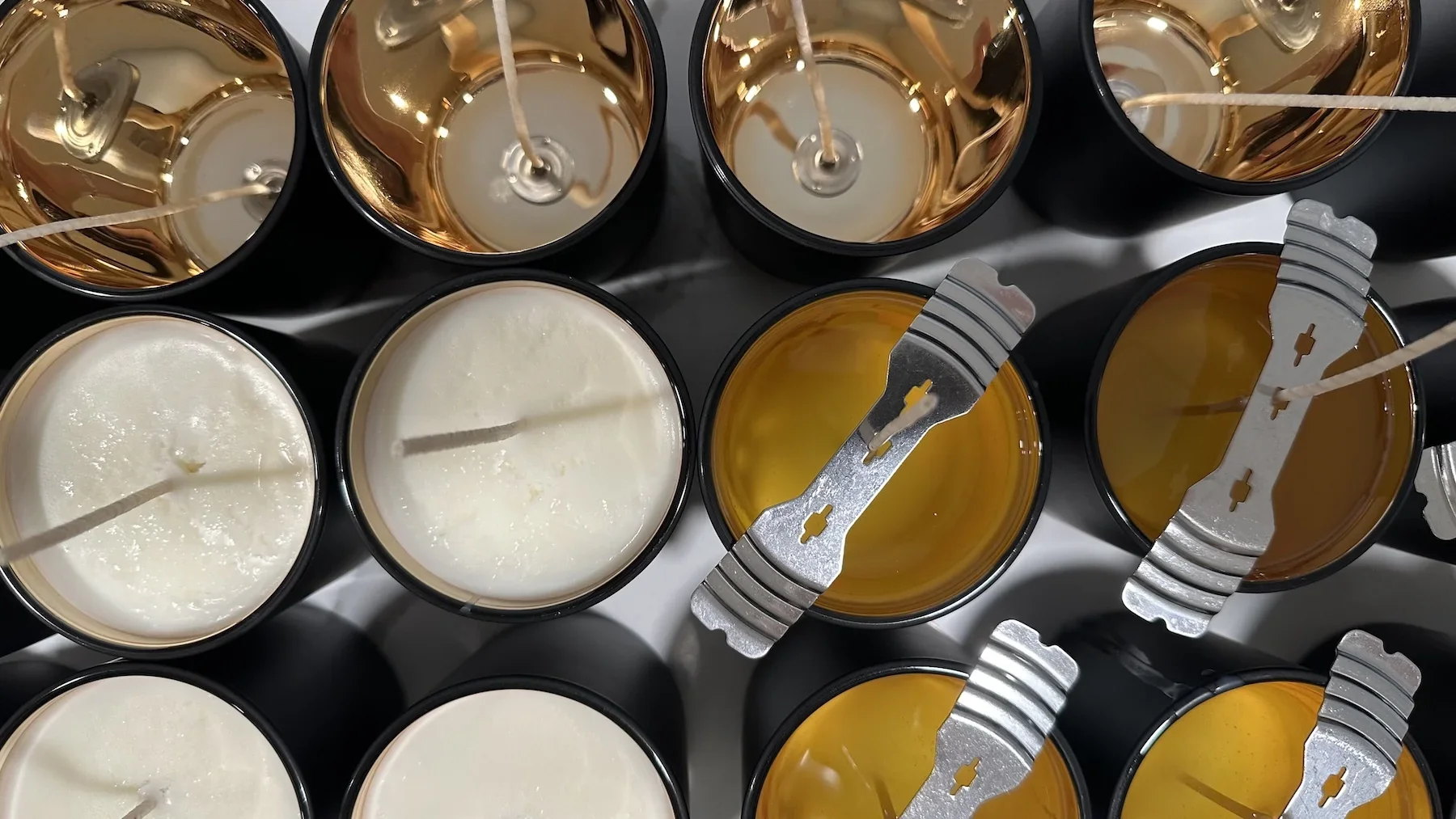Candle vessels and wax viewed from above.